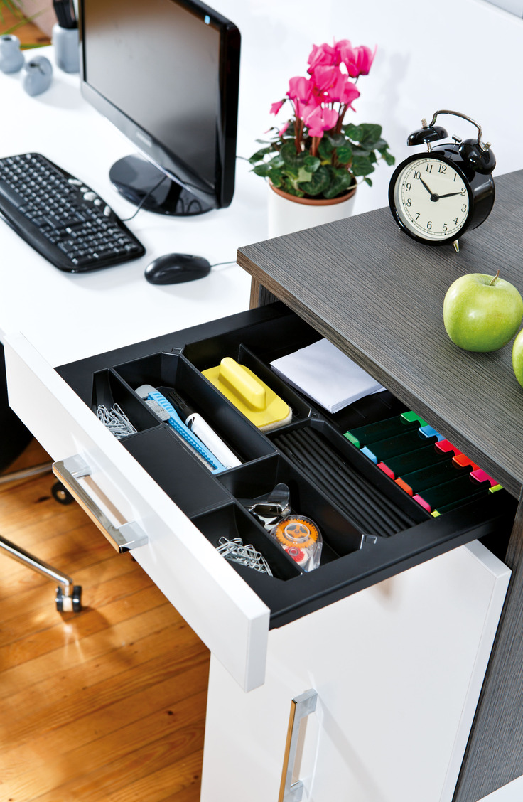 A silverware drawer organizer works perfectly for your desk. Get the most out of your tiny dorm room space with 14 items that promise better dorm room organization.