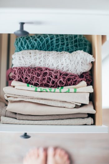 It's time to organize your kitchen with Marie Kondo's kitchen organization tips, because these are tips everyone can use! Make sure you fold your kitchen linens and place them in an upright position. That way you can see what you have and grab what you need. 