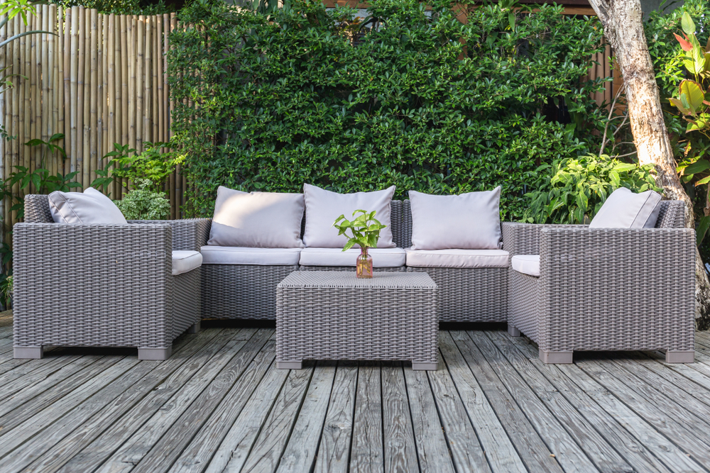 Beautiful patio furniture on a wooden deck.